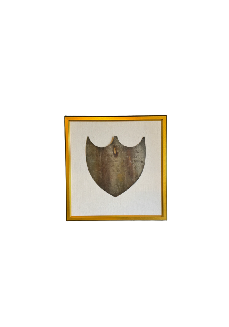 Framed Antique Metal Sign on White Linen Mat