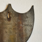 Framed Antique Metal Sign on White Linen Mat