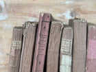 Set of 7 Antique Rose Colored Novels