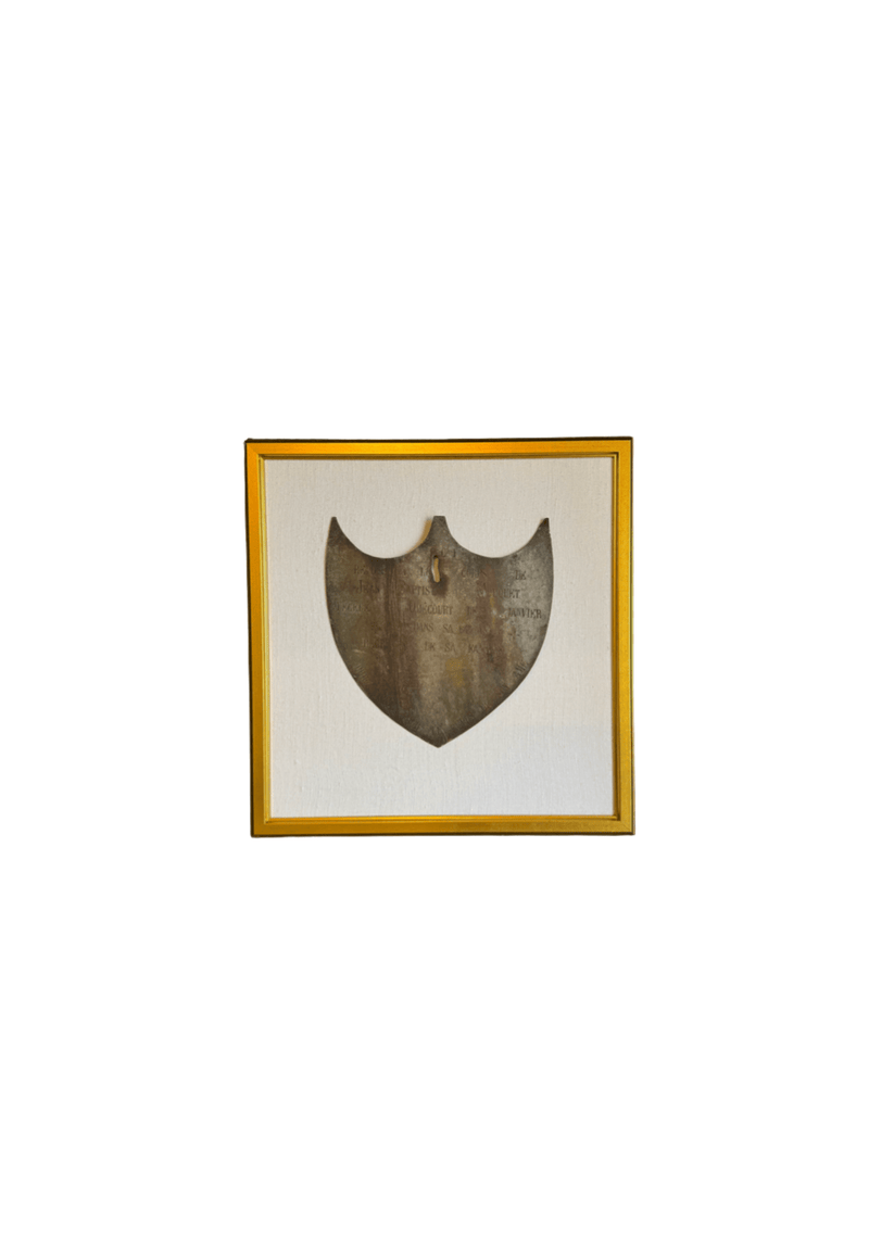 Framed Antique Metal Sign on White Linen Mat